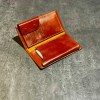 کیف پول دستی چرم طبیعی مدل دکمه ای برند ROMA رنگ قهوه ای کد 17406