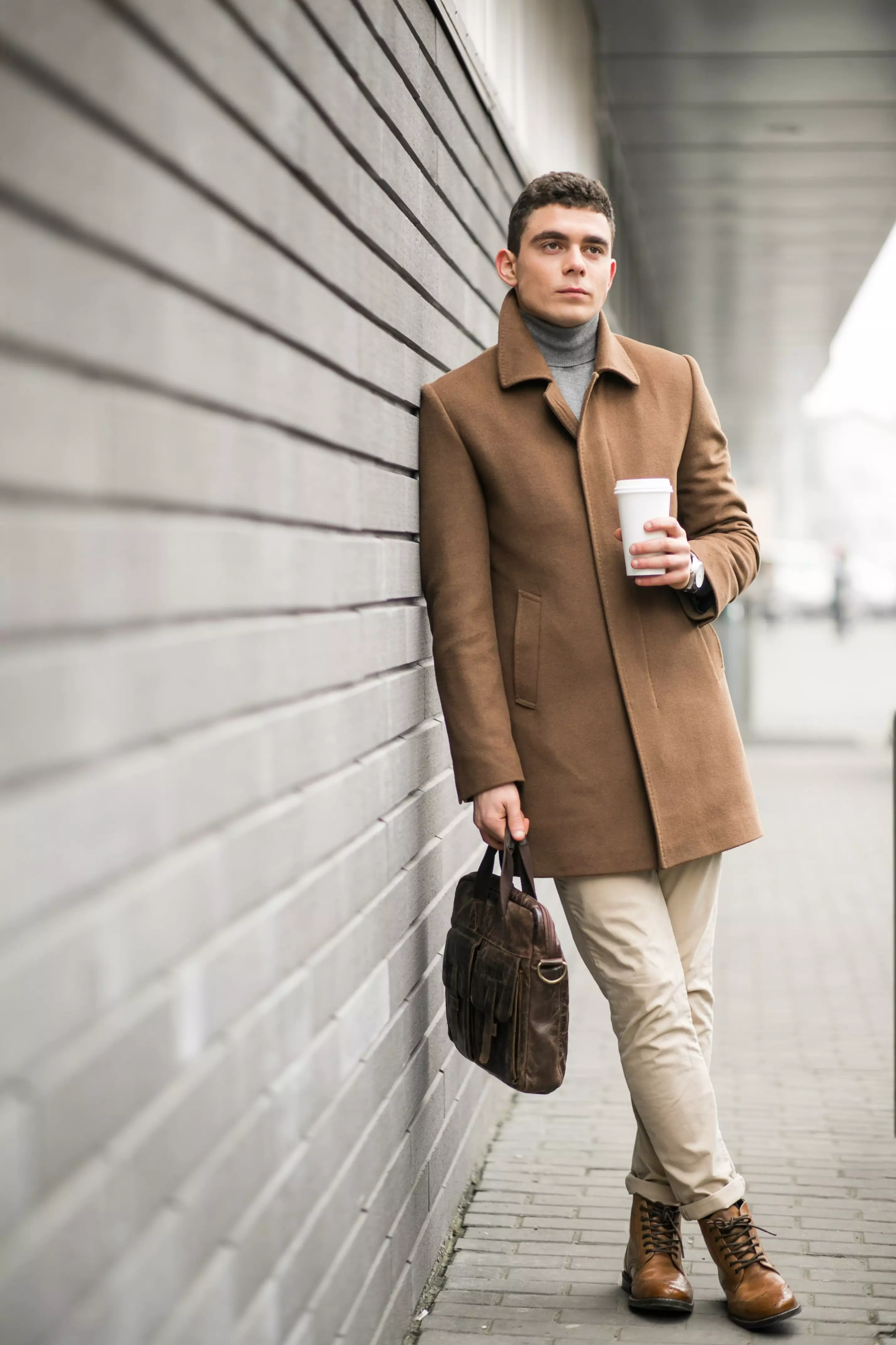 man-brown-coat-with-coffee-min